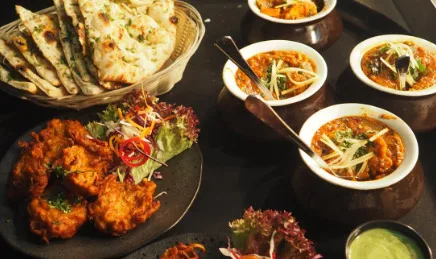 Popular Indian main course dishes like Indian bread, Naan, Dal Makhani, Chicken