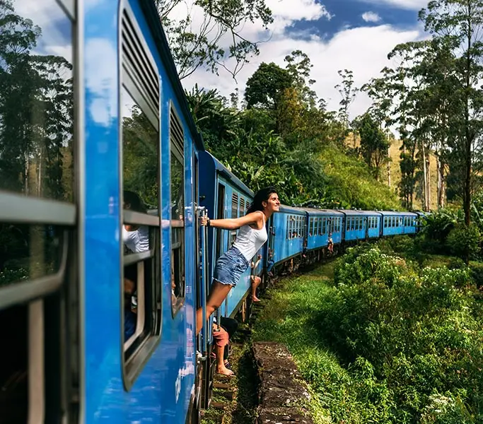 Girl enjoying travelling by Indian train