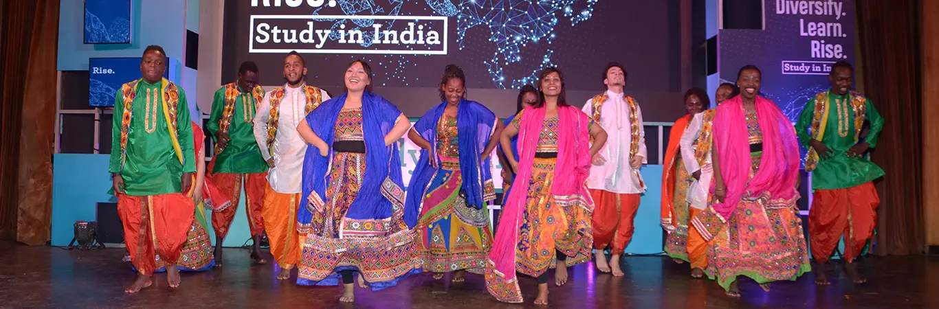 Students from different countries dancing at Study in India launch event