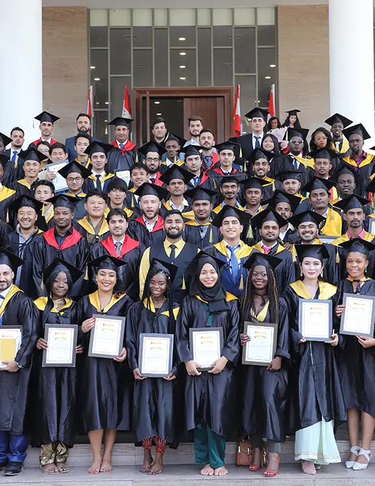 Group of students posing with their degree on convocation day